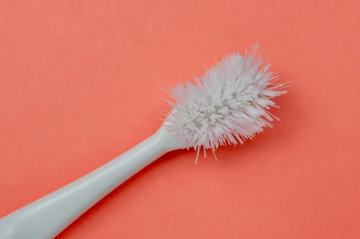 old toothbrush cleaning close-up home