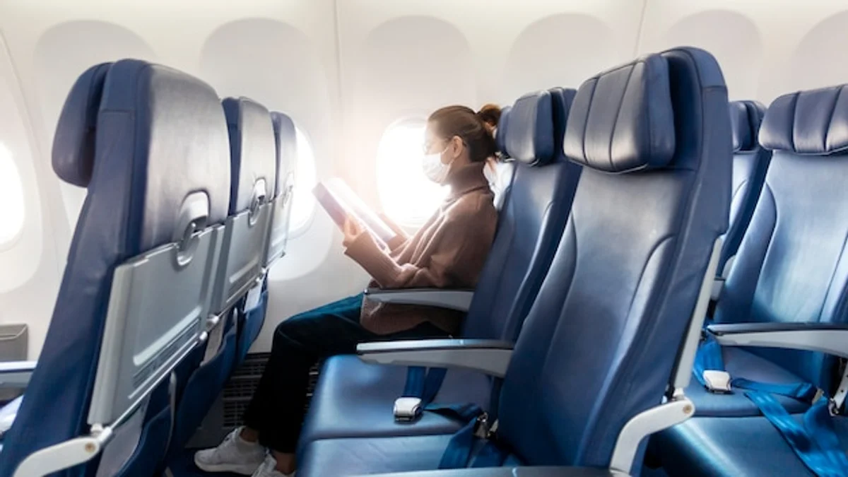 business traveler sleeping eye mask airplane window light