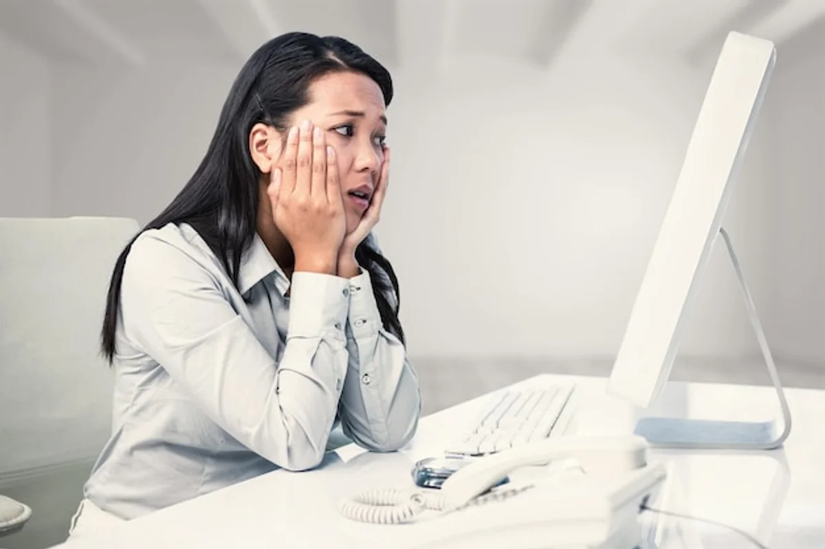 overworked tired business person at desk office exhaustion germany