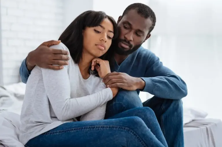 attentive couple listening sofa happy