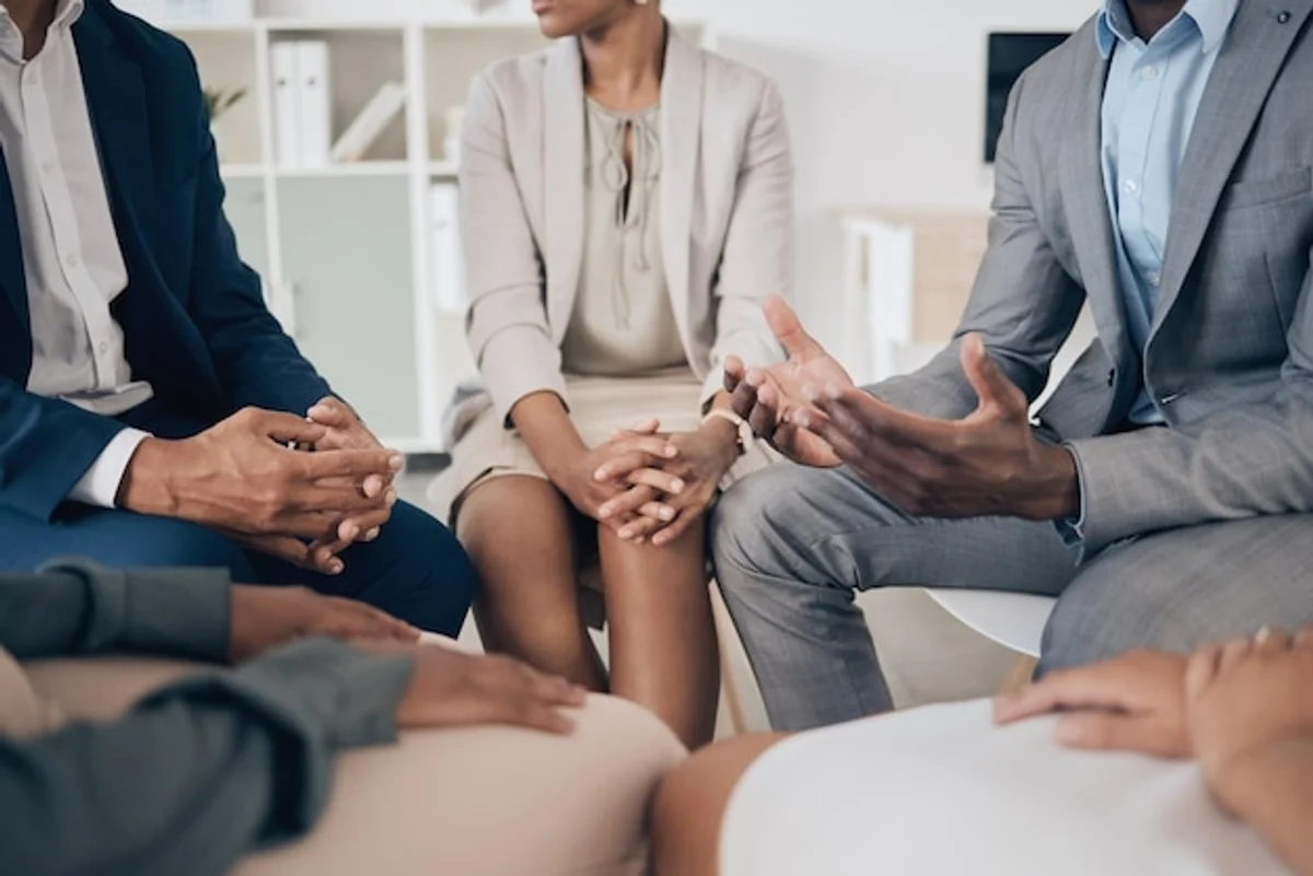 employee talking support group workplace wellbeing