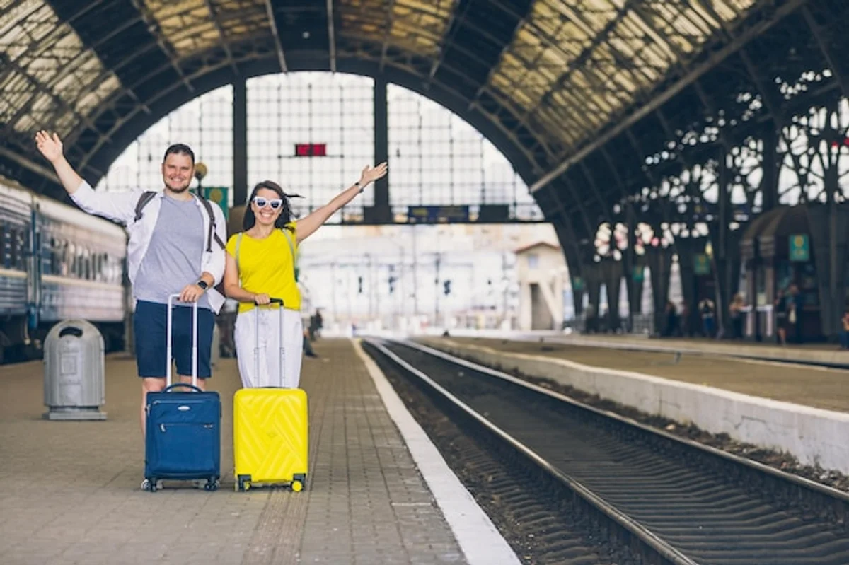family using smartphone train station germany