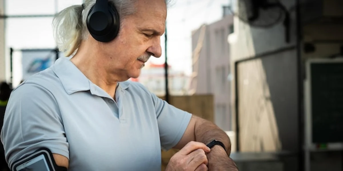 elderly person using a smartwatch outdoors modern lifestyle