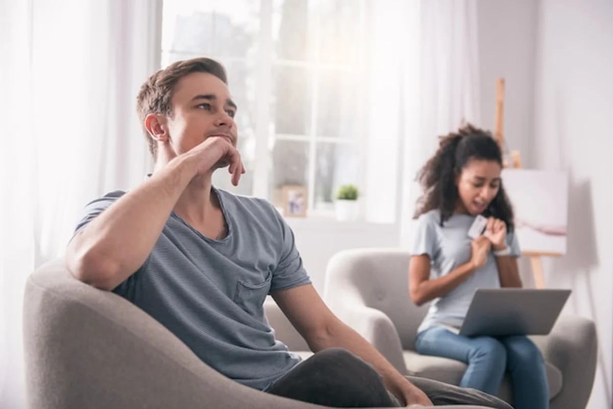 couple thoughtful listening sofa home
