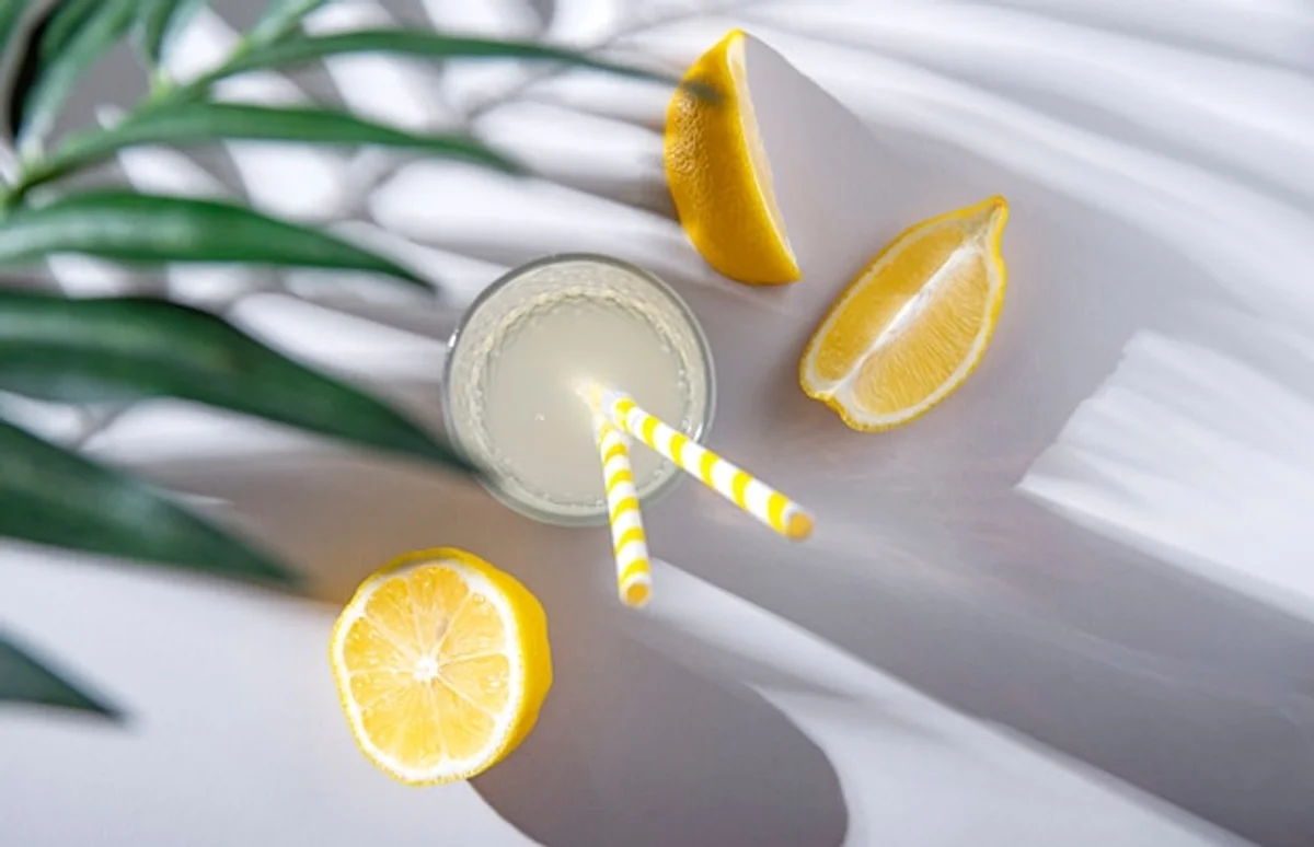 fresh lemon water on table with sunlight