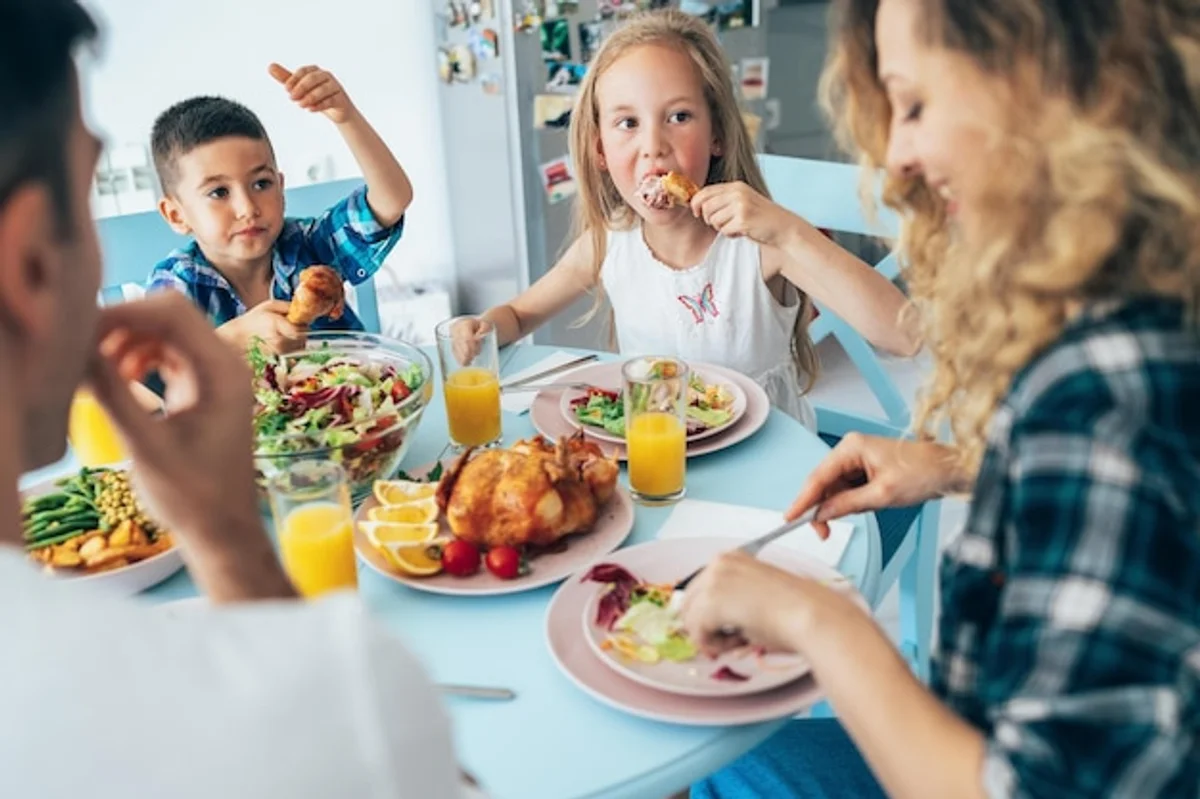child cooking vegetables with family kitchen happy germany