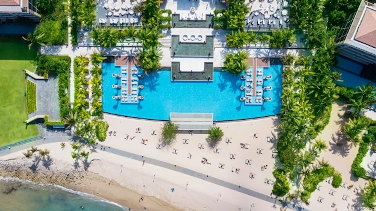 crowded hotel swimming pool high season holiday tourists