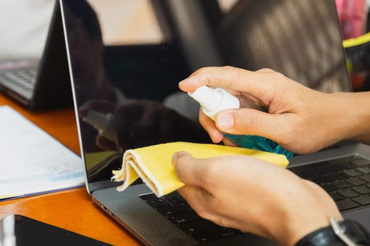 proper laptop screen cleaning with spray and microfiber cloth