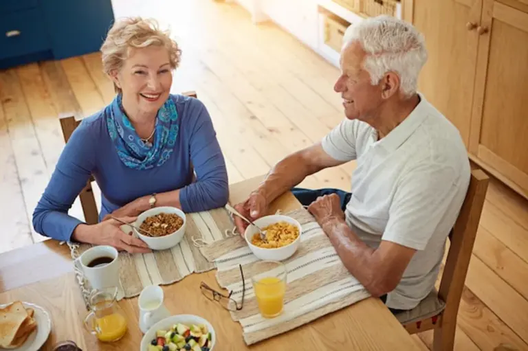 elderly people eating superfood meals together