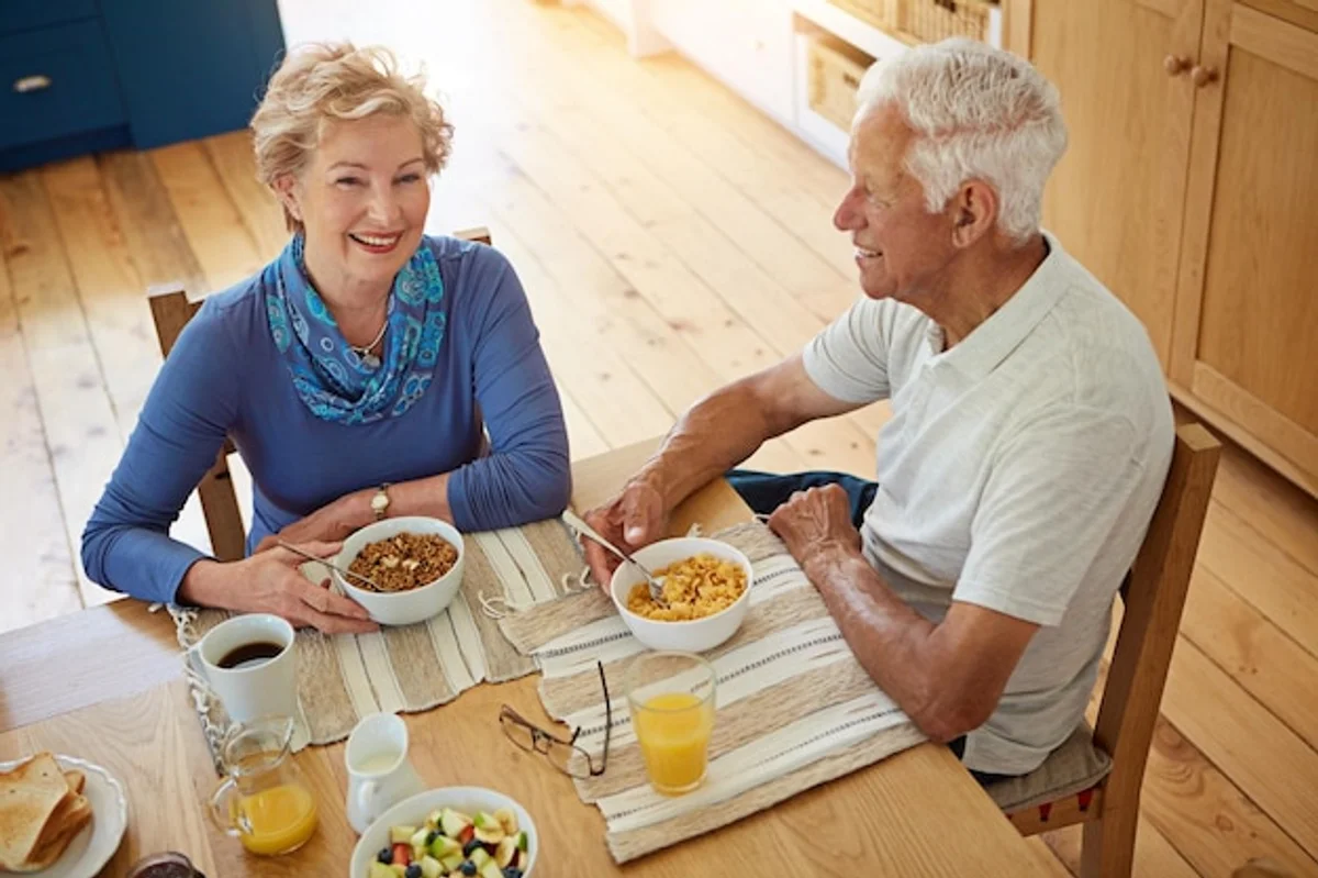 elderly people eating superfood meals together