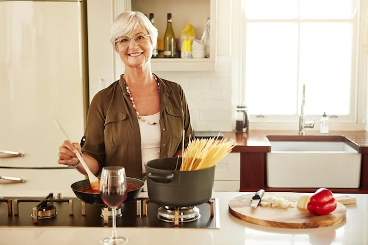 elderly woman cooking healthy superfood meal kitchen