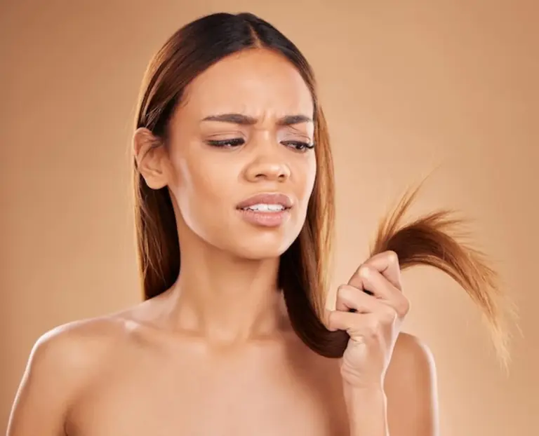woman with dry hair looking frustrated
