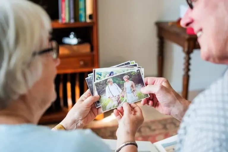 nostalgic family looking at old photos together