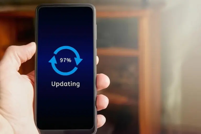man holding smartphone with update icon on screen