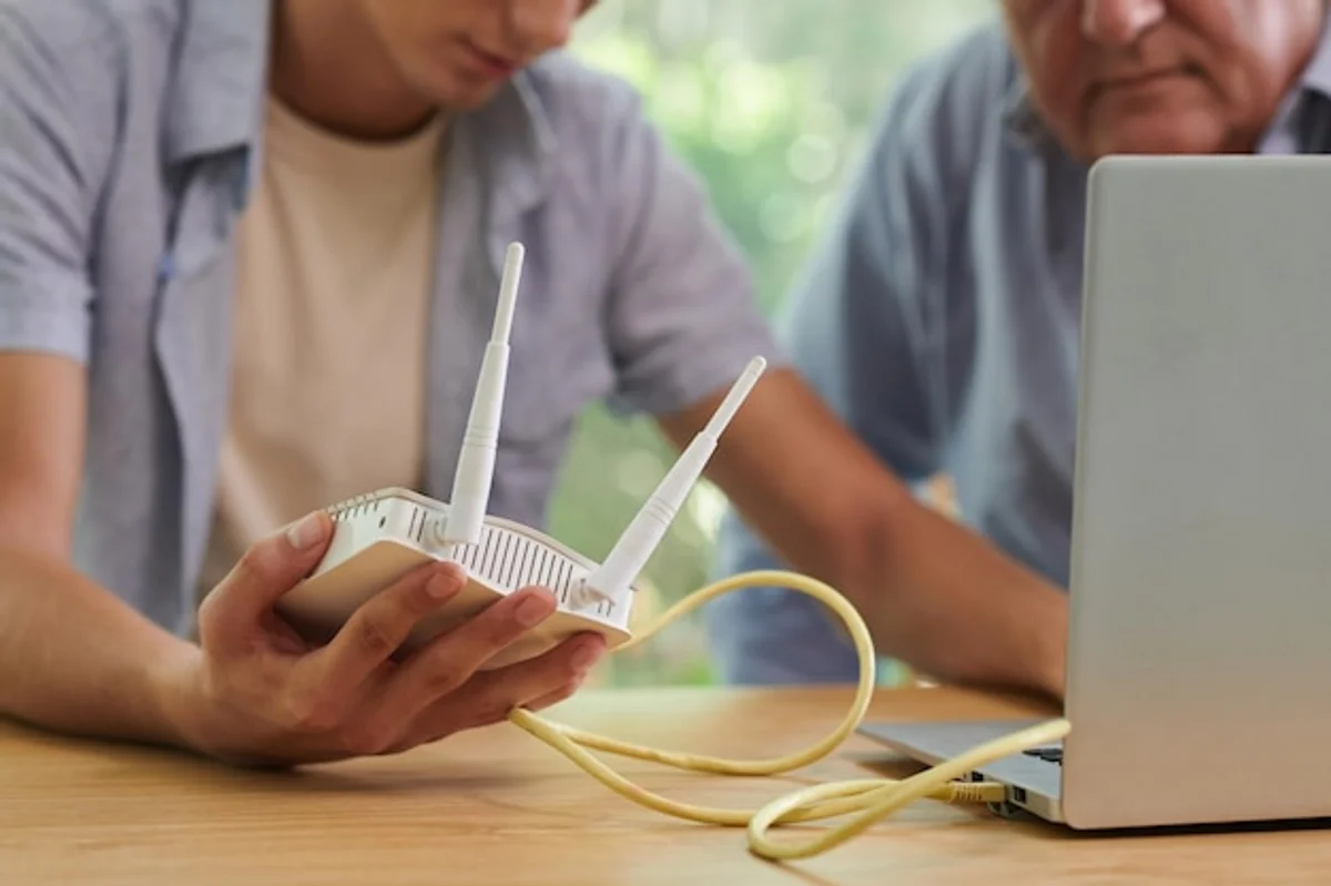 person updating home WiFi router