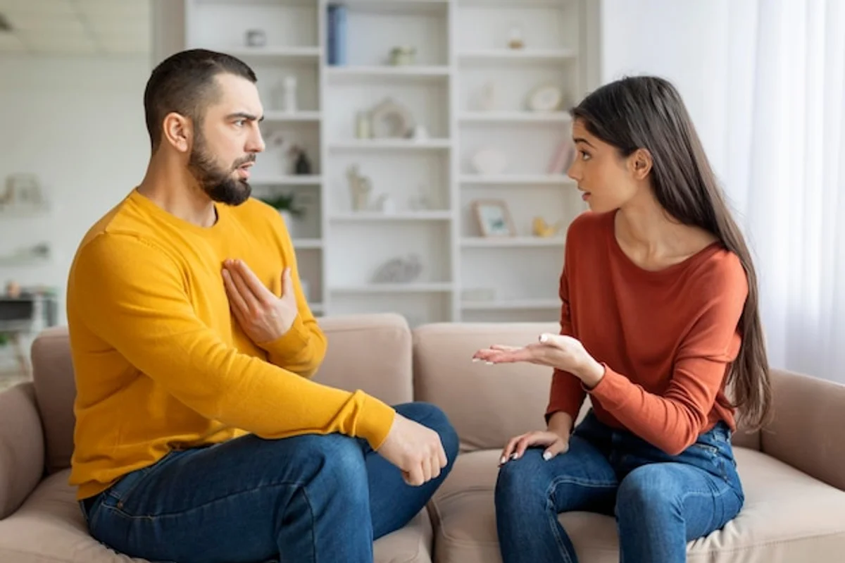 intimate couple talking seriously living room