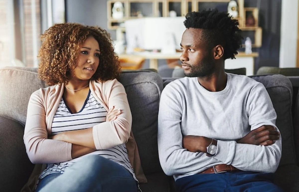couple resolving conflict communication on sofa
