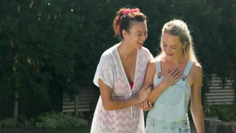 two friends reconnecting warm hug adults