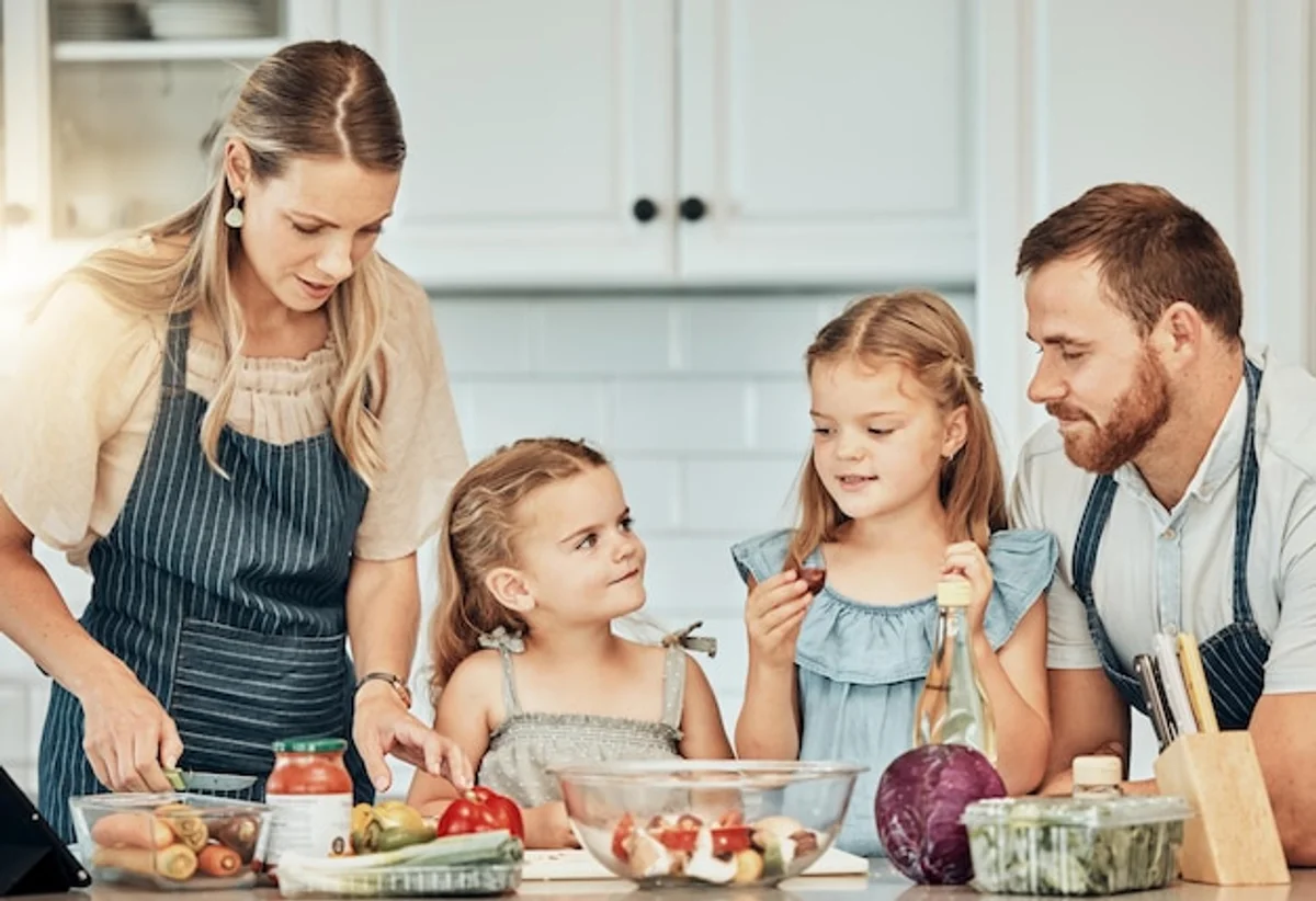 family preparing healthy snacks together for children