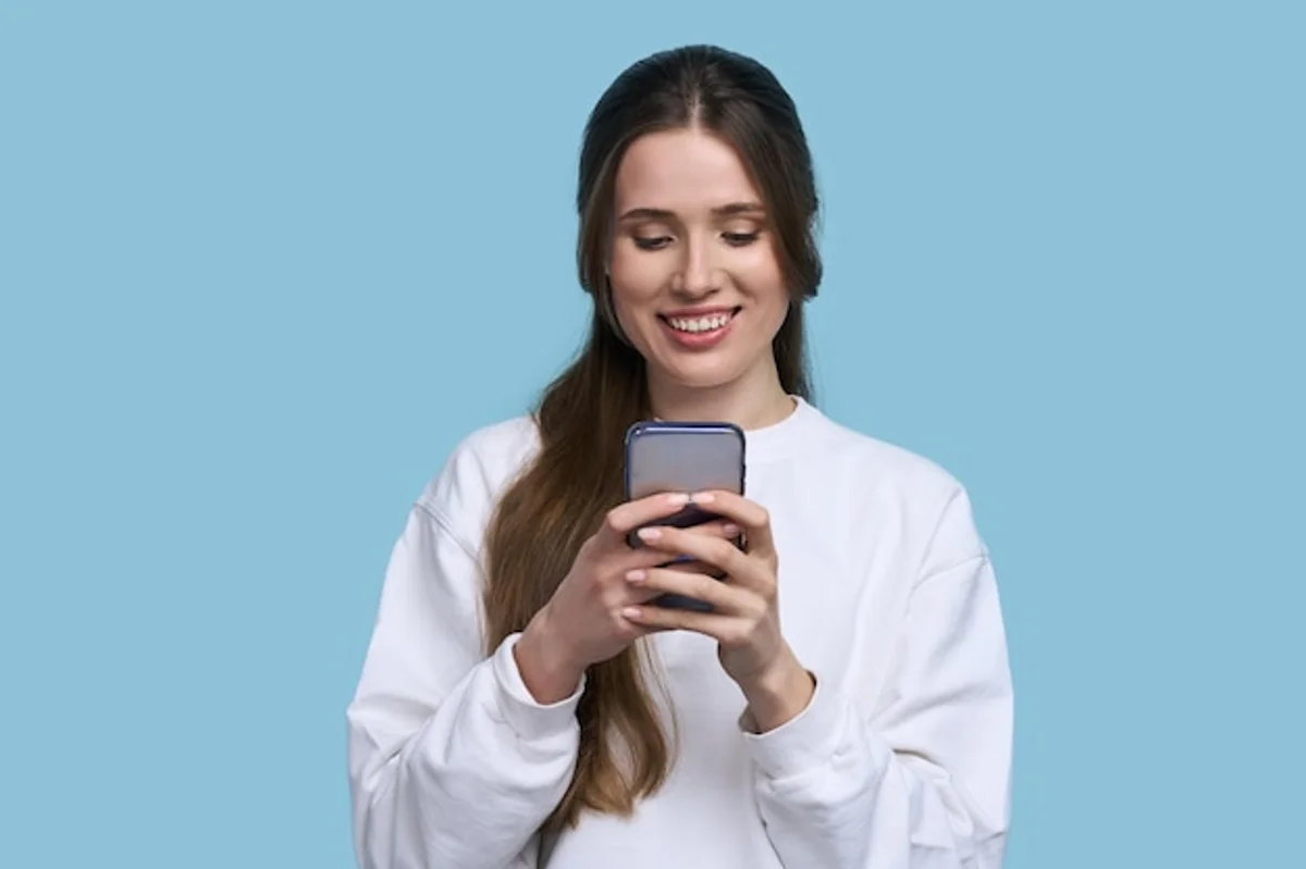 young woman checking her smartphone for app subscriptions