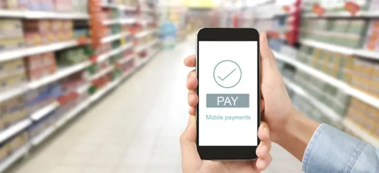 mobile payment hands smartphone supermarket germany