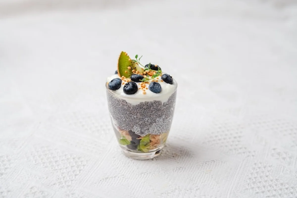chia pudding breakfast close up glass table natural light modern kitchen