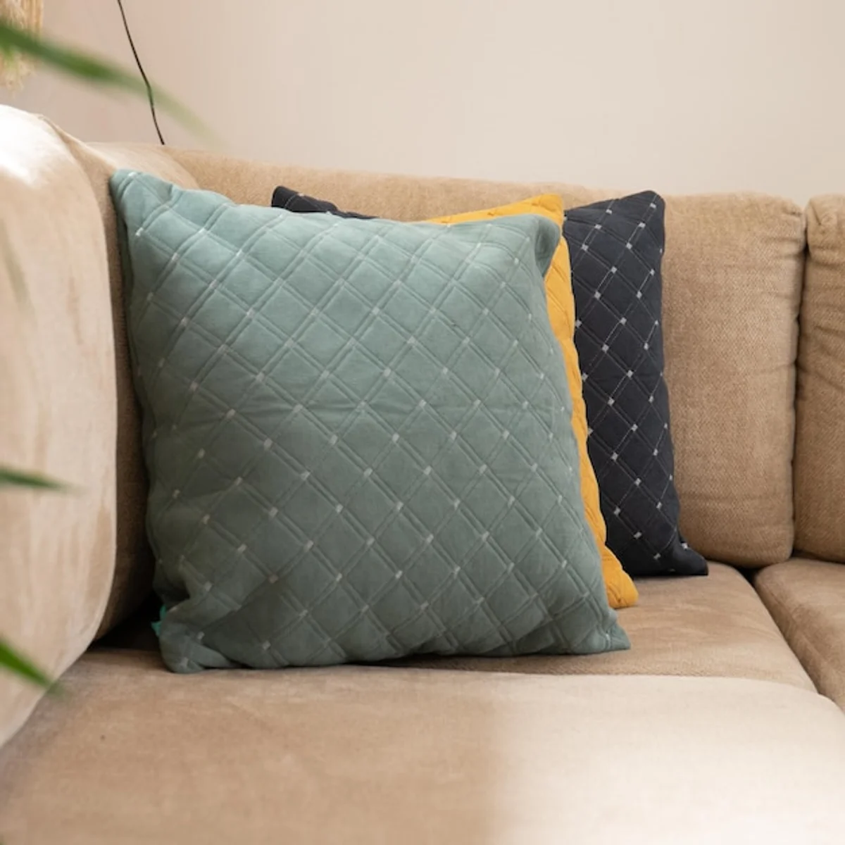 upcycled fabric cushions on sofa