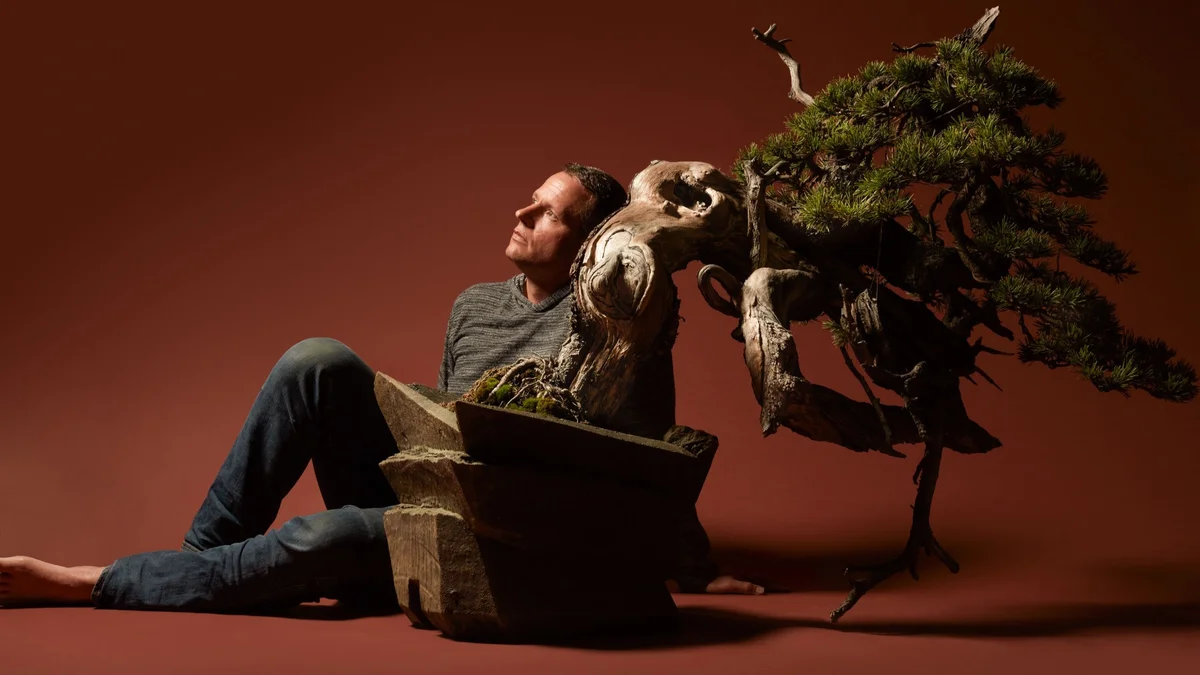 man enjoying creative hobby at home, relaxed atmosphere, real-life, not perfect