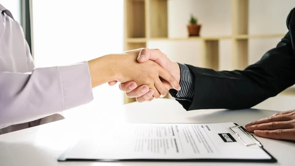 successful job interview handshake confidence