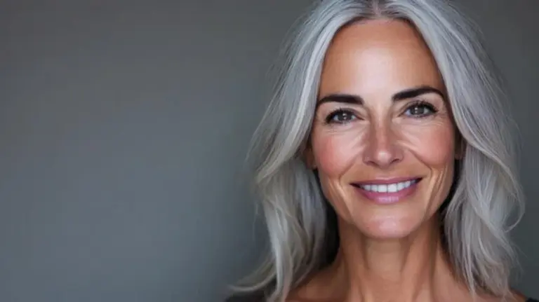 mature woman glowing skin natural light smiling relaxing