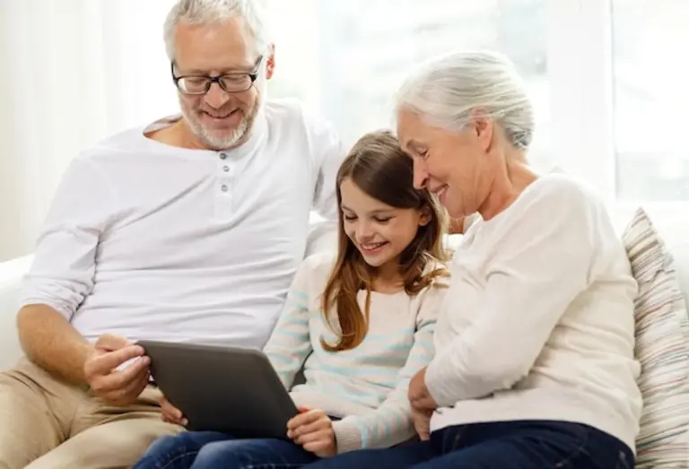 senior grandparent connecting with grandchildren friends technology happy