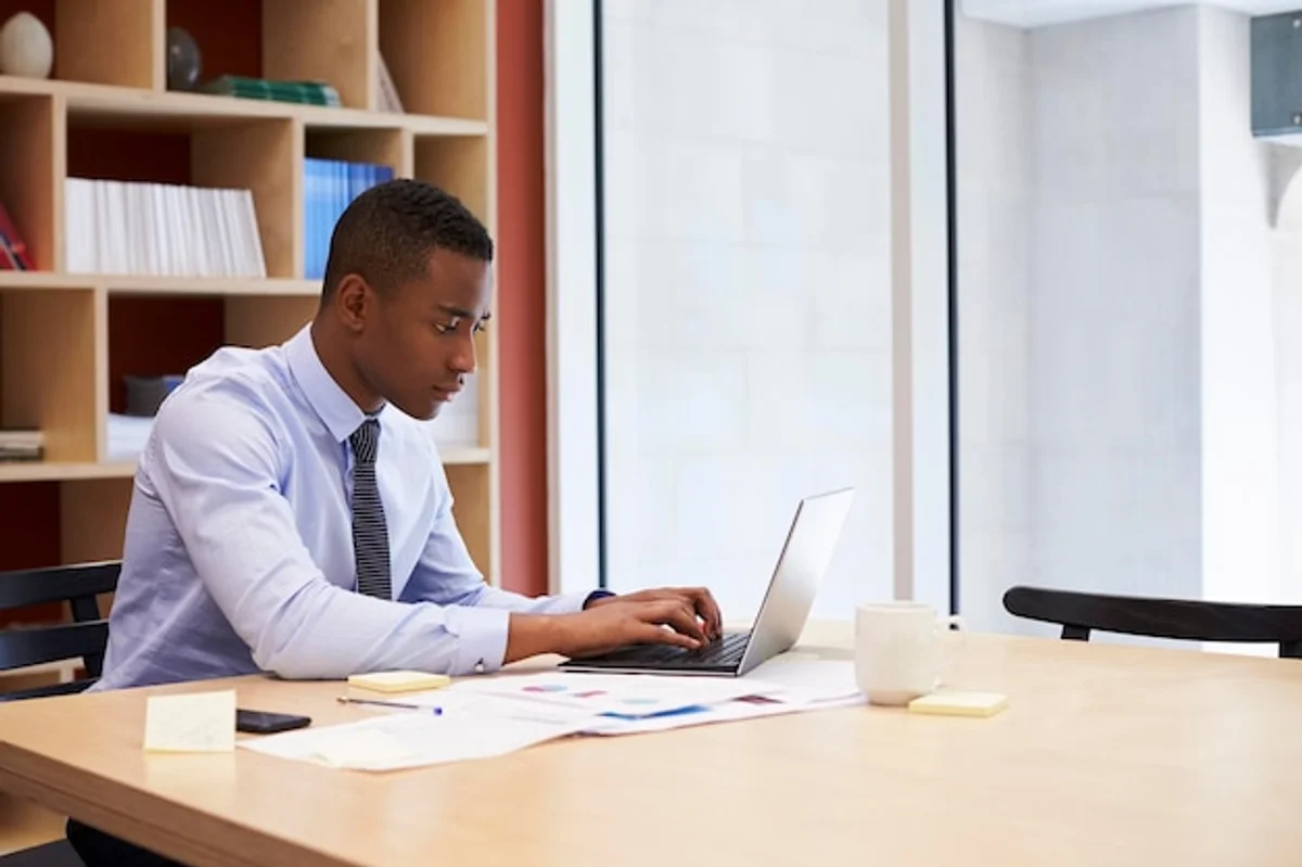 professional young adult at office working alone