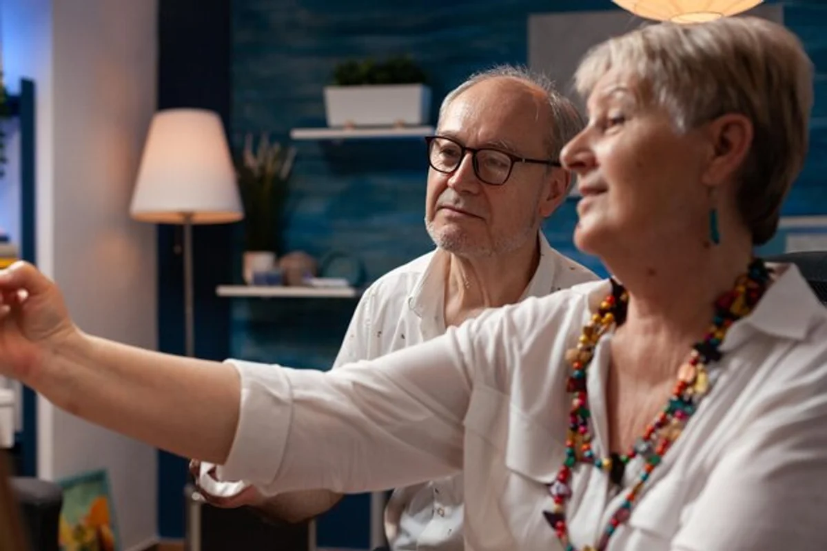 senior couple painting at home, creativity retirement hobby