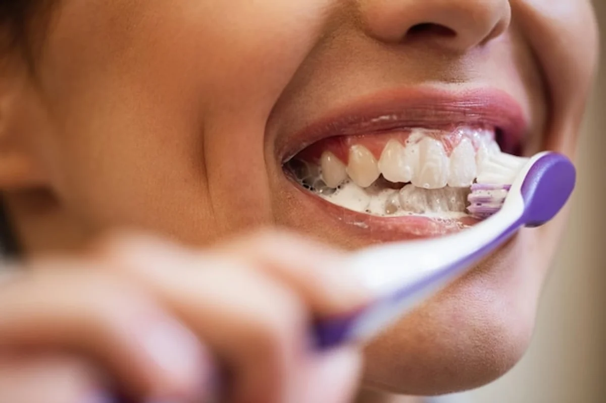 toothbrush cleaning household objects close up