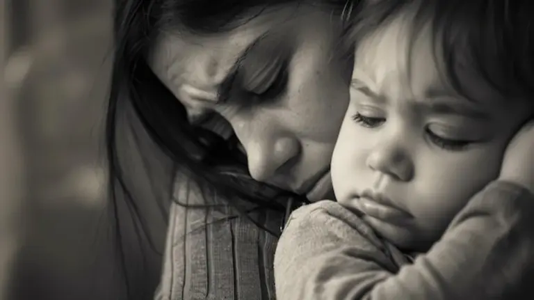 crying baby parent soothing indoors natural light