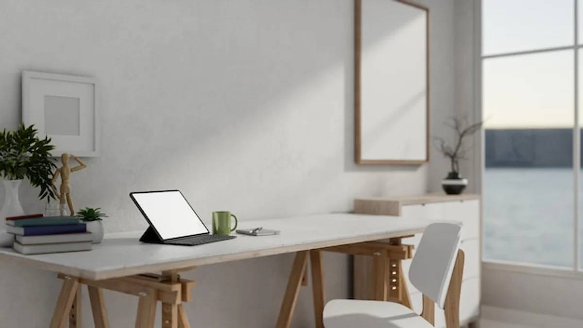 minimalist desk setup with tablet, home office feng shui