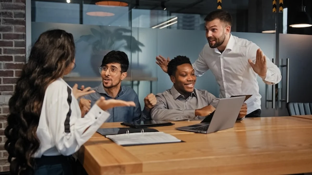 coworkers discussing misunderstanding mistake office