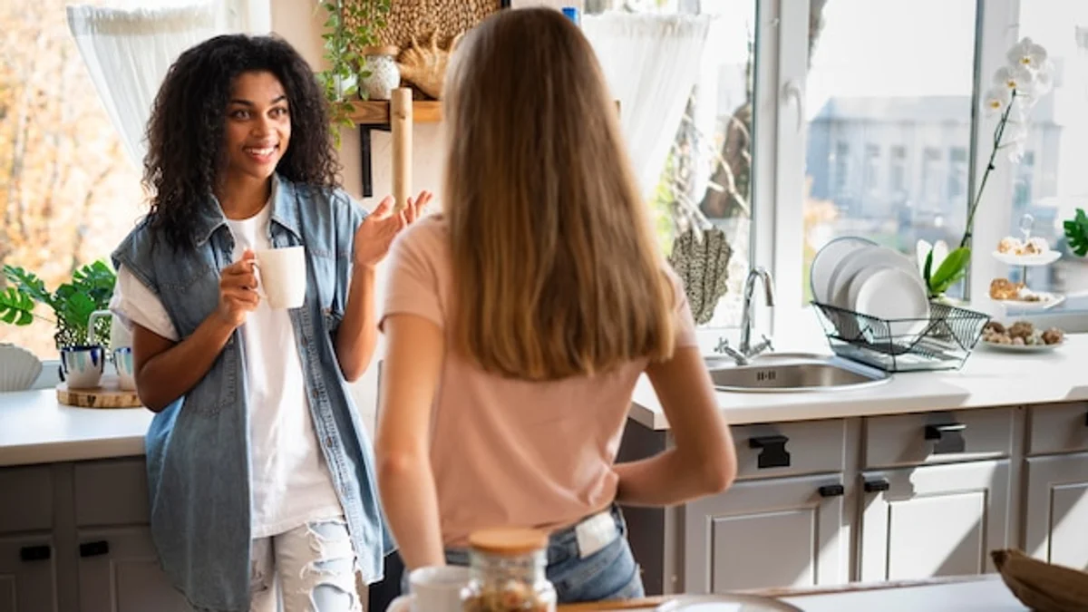 serious conversation between two people in modern kitchen