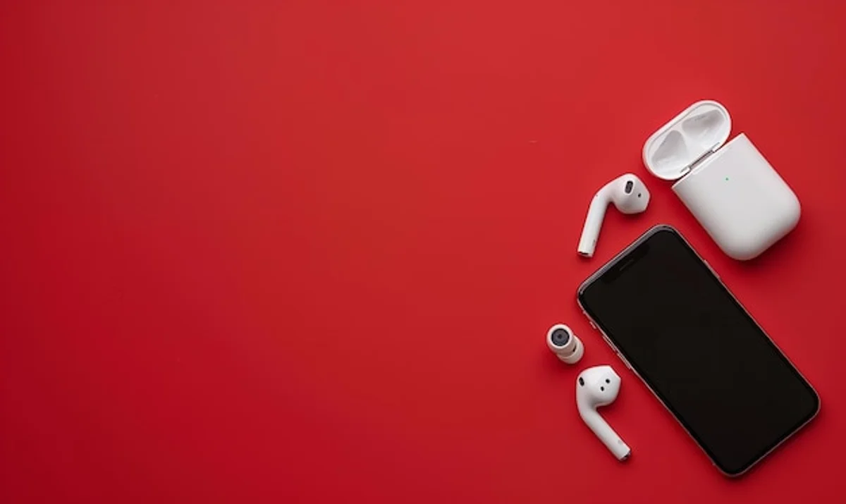 Affordable true wireless earbuds on colorful background flatlay