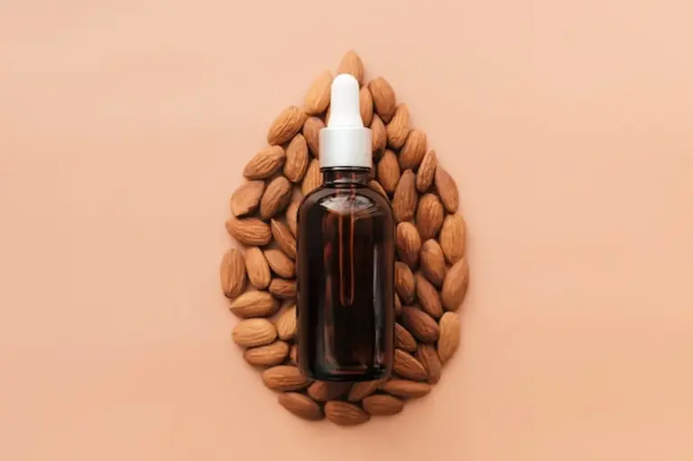 natural oil skincare flat lay, glass bottles with jojoba and almond oil