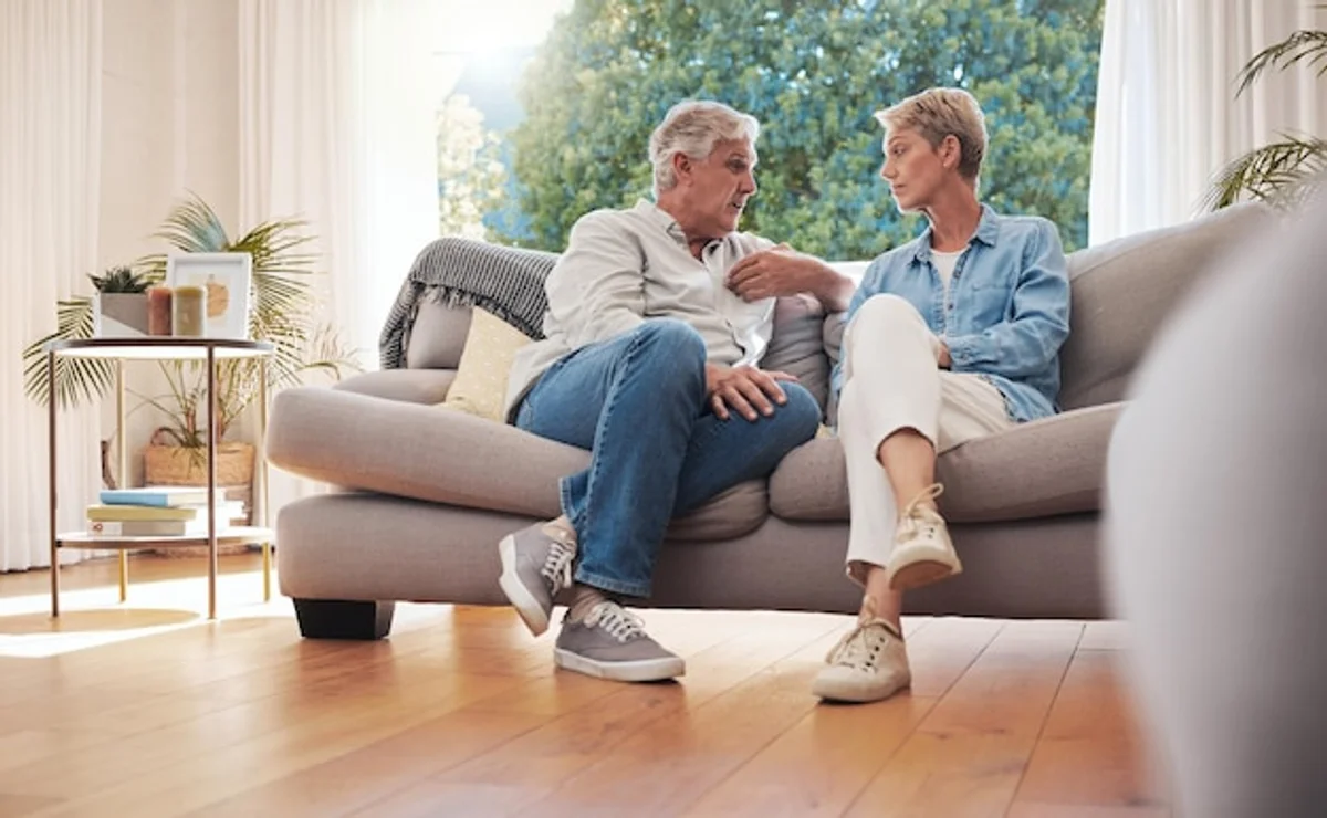 couple communication serious conversation living room